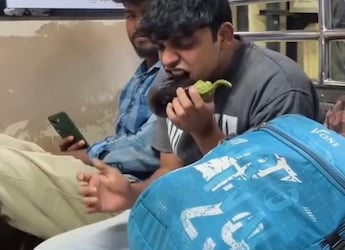 Watch: Vlogger Eats Raw Brinjal, Ginger-Ketchup And More Bizarre Foods In Mumbai Local Train, Passengers React