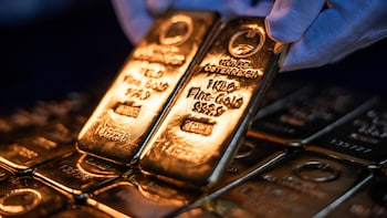 Gold Rises Toward $5,000 As Weaker Dollar Adds Impetus To Rally