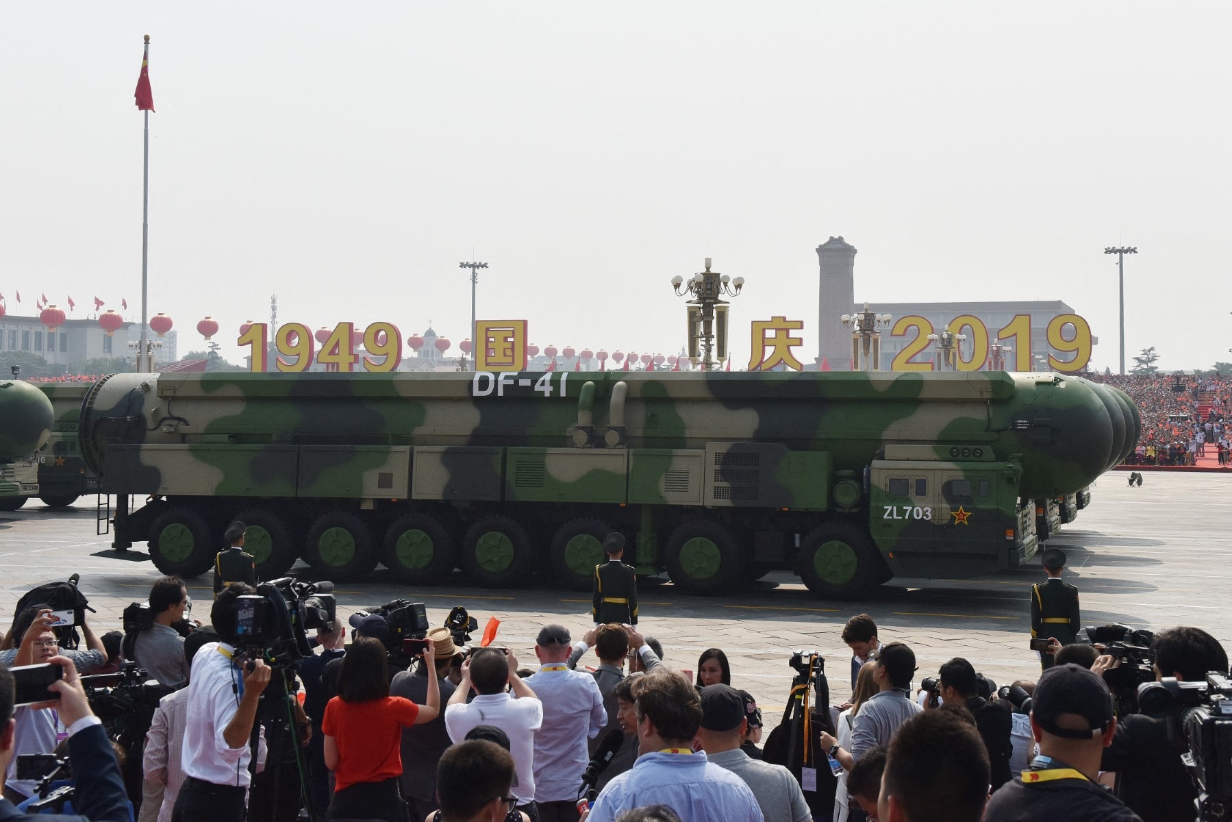 Military vehicles carry Chinas DF-41 nuclear-capable intercontinental ballistic missiles in 2019