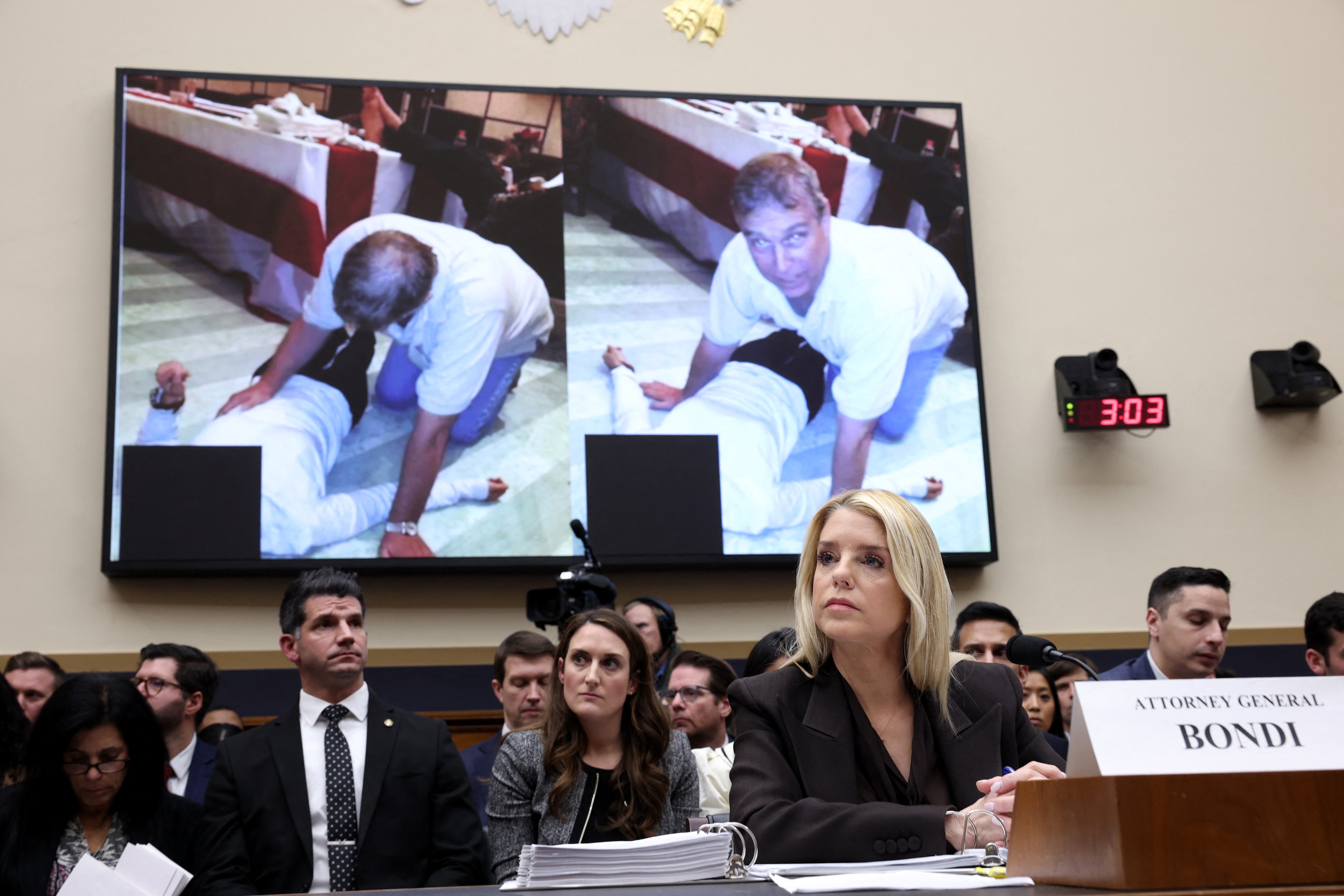 A photo of Andrew Mountbatten Windsor is displayed as US Attorney General Pam Bondi testifies before the House Judiciary Committee on February 11, 2026