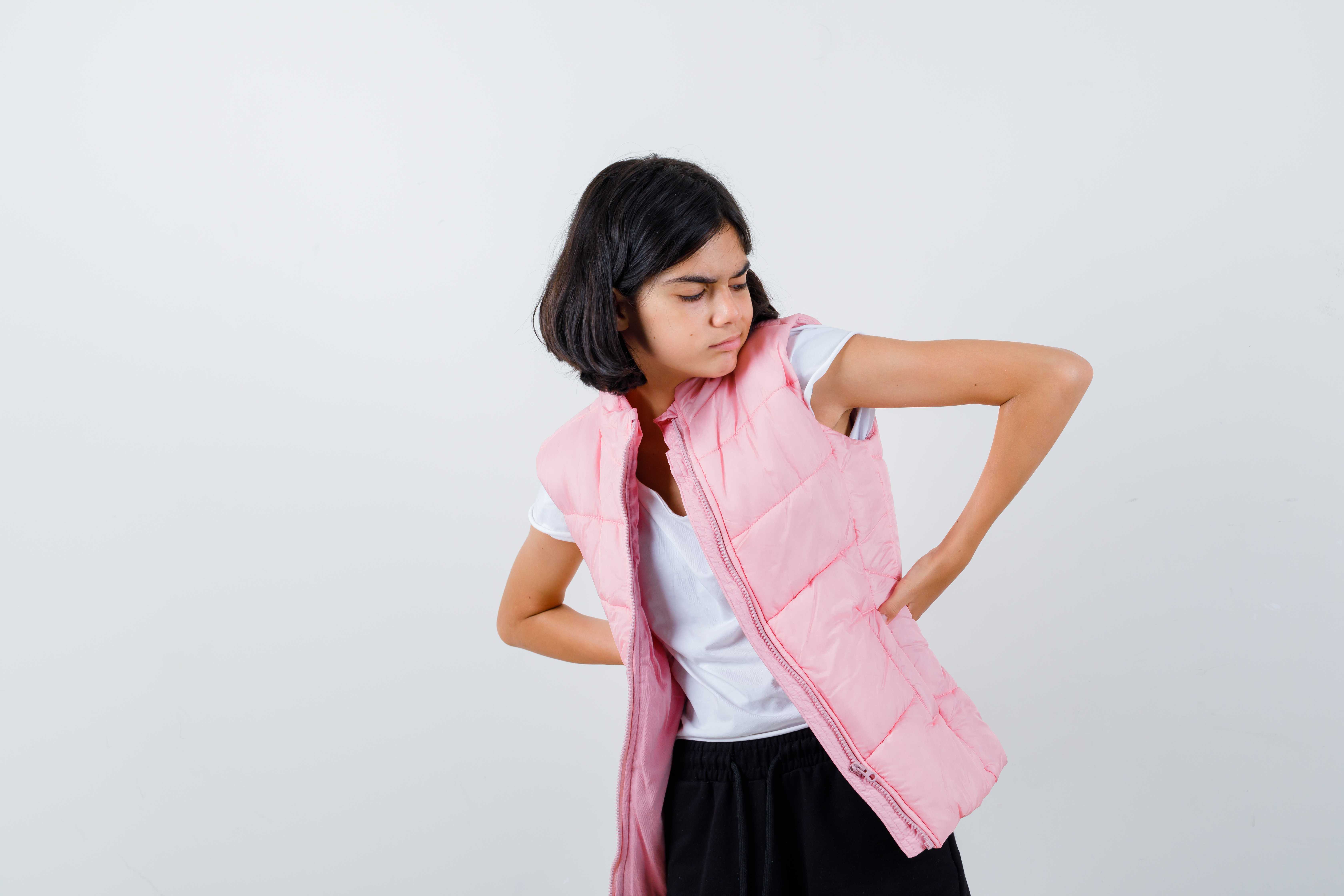 Children's back pain is rising due to heavy bags, poor posture, screen time, and low activity.