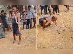बहादुरी या पागलपन? बिना डरे मुंह से सांप उठा लेता है ये शख्स, देखकर उड़ जाएंगे होश