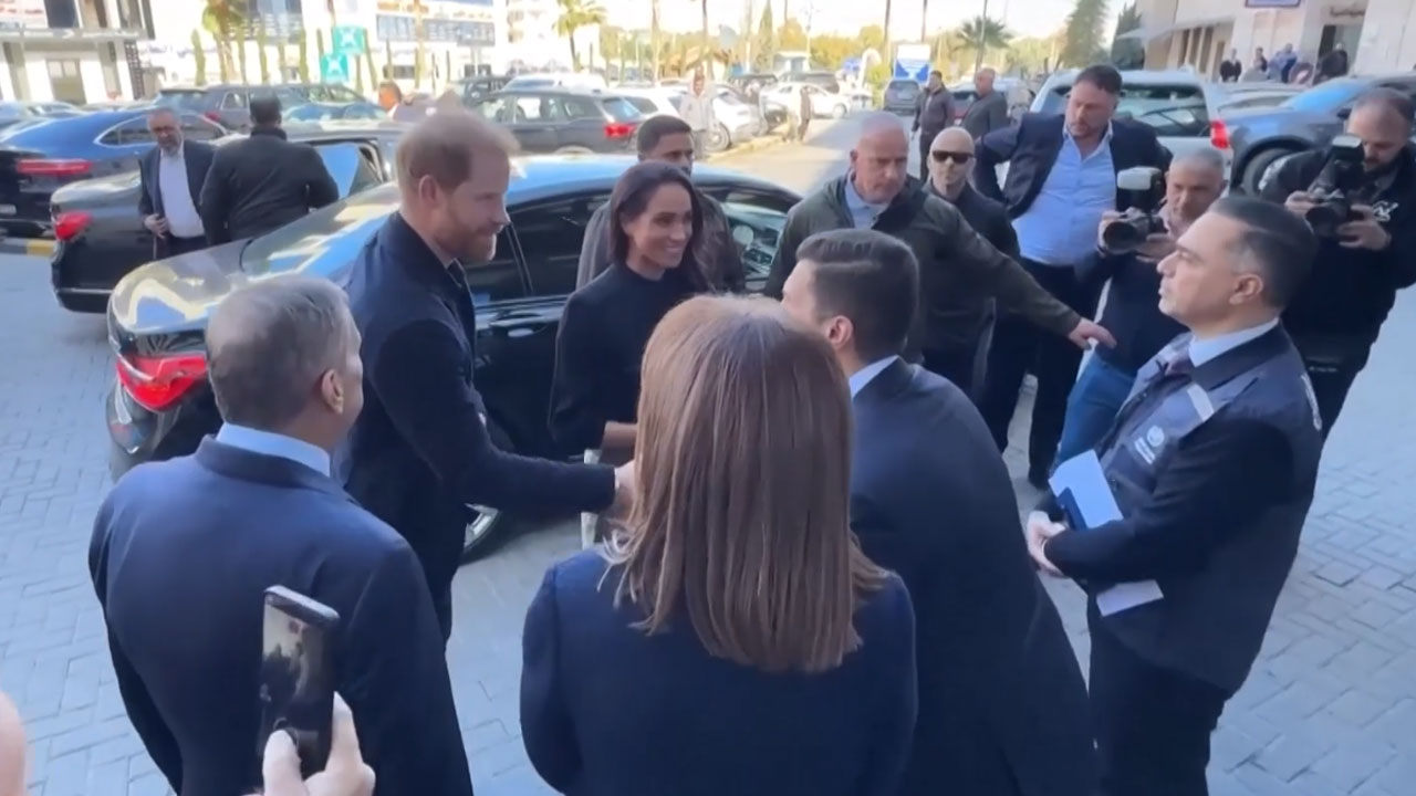 Prince Harry And Meghan Greet People Outside Specialty Hospital In Jordan's Amman
