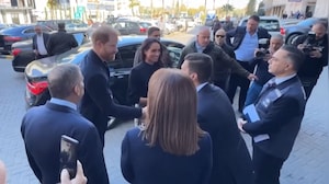 Prince Harry And Meghan Greet People Outside Specialty Hospital In Jordan's Amman