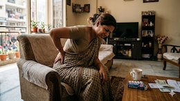 Got Lower Back Pain? Here's What To Try Before Reaching For Painkillers