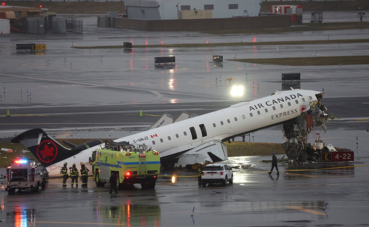 Damaged Air Canada Express jet seen after collision with a ground vehicle at New Yorks LaGuardia Airport