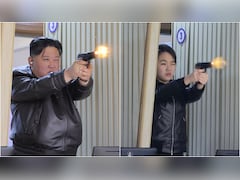 Pics: North Korea's Kim, Daughter Try New Pistols At Shooting Range