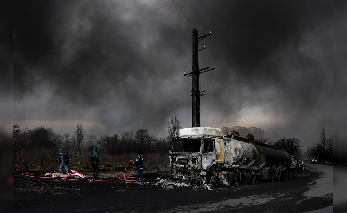 Smoke rises after a strike on Shahran fuel tanks in Tehran on Saturday. (Reuters)