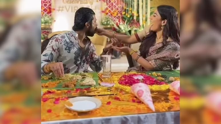 Rashmika Mandanna Feeds Husband Vijay Deverakonda At Virosh Fan Meet In Hyderabad. Watch