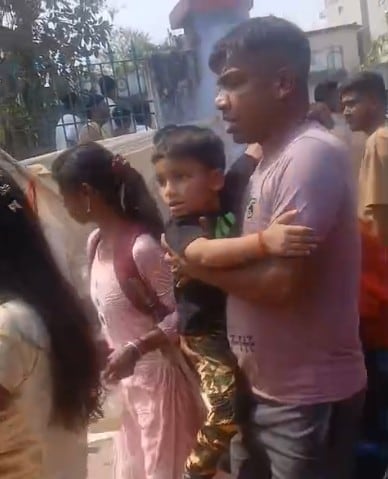 A family running for cover 