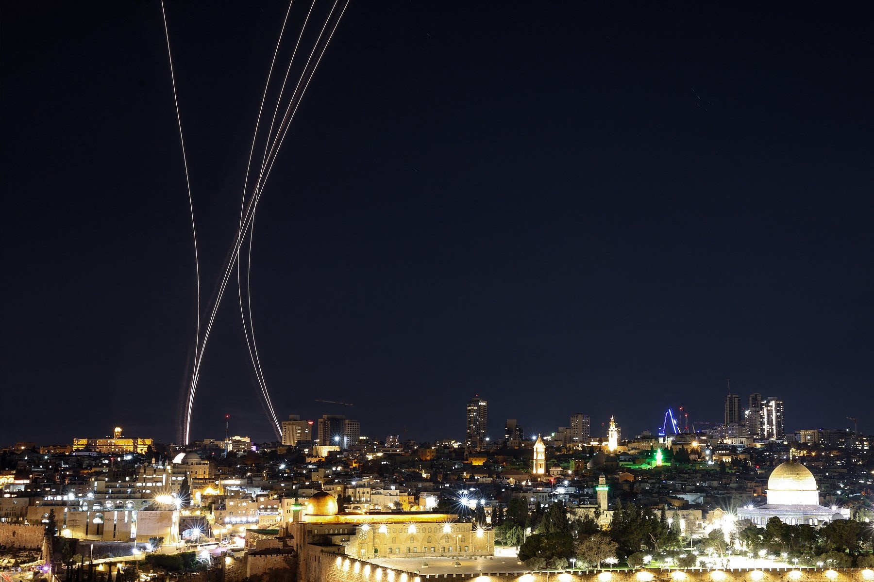 Rocket trails from an interception by Israels Iron Dome missile defence system are pictured over Jerusalem on March 1, 2026.