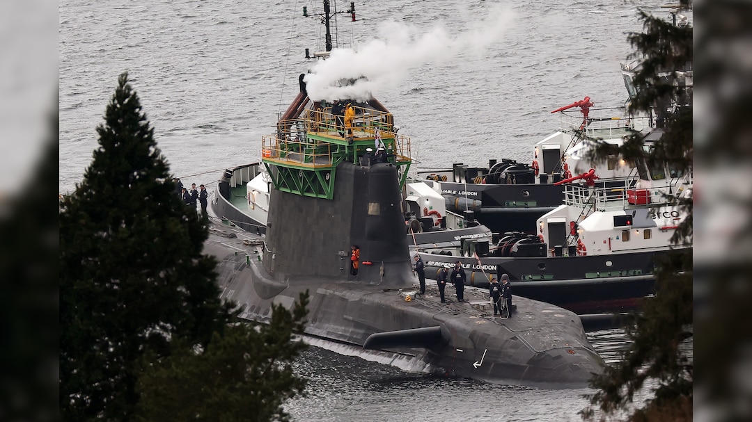 A Royal Navy submarine maneuvers in Faslane, Scotland. The UK relies on the US to supply the missiles that arm its four Trident submarines.