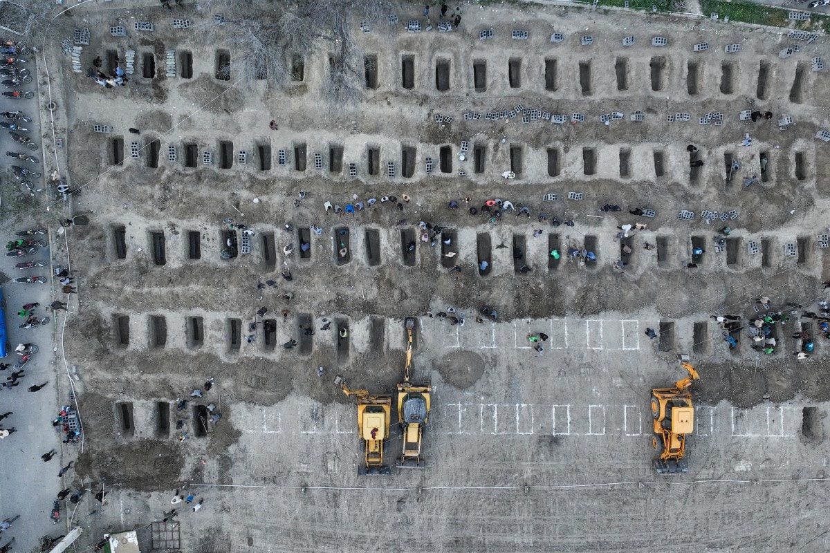 In this aerial handout picture released by the Iranian Press Center, mourners dig graves during the funeral for children killed in a reported strike on a primary school in Iran's Hormozgan province in Minab on March 3, 2026. In this aerial handout picture released by the Iranian Press Center, mourners dig graves during the funeral for children killed in a reported strike on a primary school in Iran's Hormozgan province in Minab on March 3, 2026.