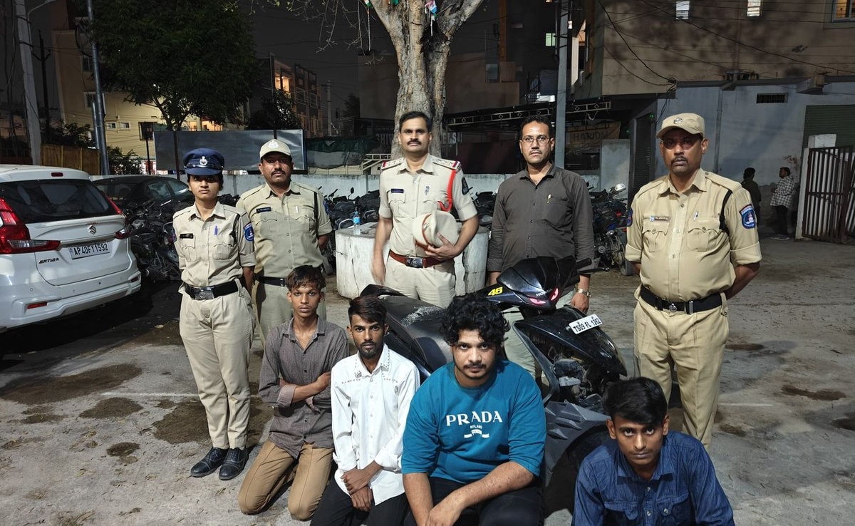 4 Men In Hyderabad Perform Stunts On Scooter For Reels In Front Of Cop Car