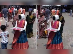 साड़ी पहनकर वोटर्स का स्वागत कर रहा रोबोट! तमिलनाडु चुनाव में दिखा अनोखा नजारा - देखें Video