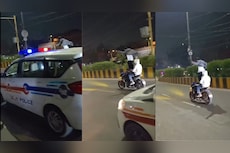 Delhi Man Performs Standing Stunt On Moving Bike In Front Of Police Car, Traffic Police Takes Action