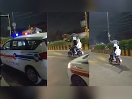 Delhi Man Performs Standing Stunt On Moving Bike In Front Of Police Car, Traffic Police Takes Action