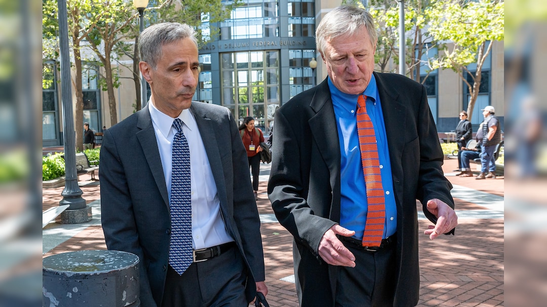 Attorney William Savitt, representing OpenAI, left, leaves federal court in Oakland, California on April 27.
