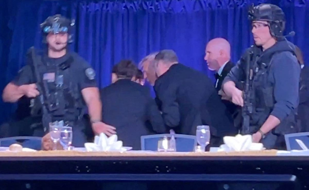 Trump is escorted out as a shooter opens fire.