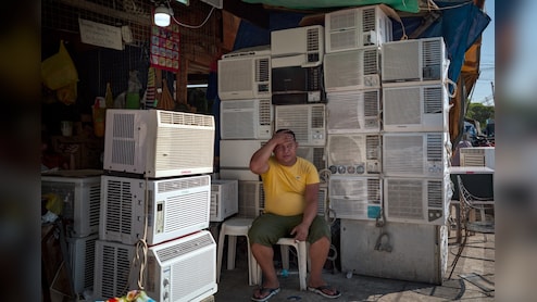 Southeast Asia Office Workers Swelter in Energy-Saving Drive, Heat Wave