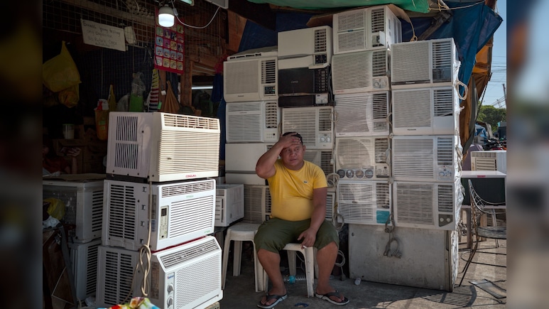 Southeast Asia Office Workers Swelter in Energy-Saving Drive, Heat Wave