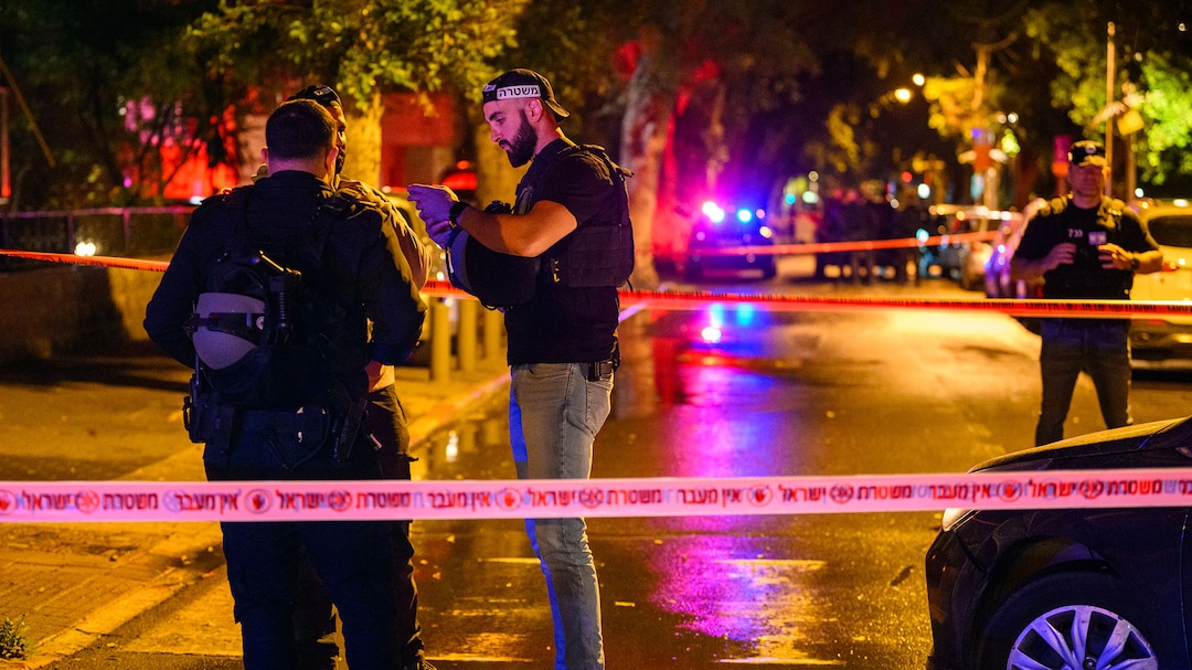 First responders attend the site of an Iranian missile attack in Tel Aviv on April 2. 
