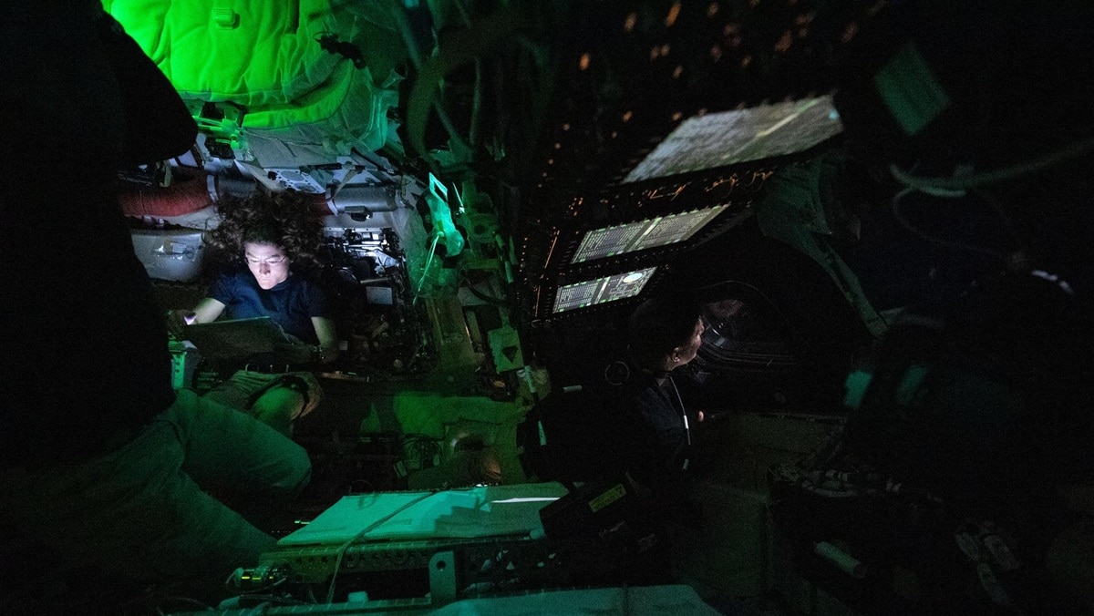 Astronauts pictured inside the Orion capsule.