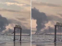 Video: Iranian Girl Swings As Smoke Rises In Background After US-Israel Strike
