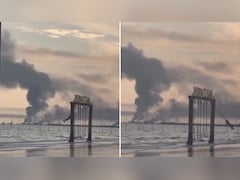 Video: Iran Girl Swings As Smoke Rises In Background After US-Israel Strike