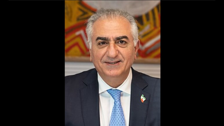Protester Splashes 'Red Fluid' On Iran's Exiled Prince Reza Pahlavi Over Pro-War Rhetoric | Watch Video