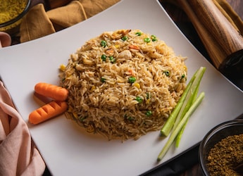 The Real Reason Your Homemade Fried Rice Turns Mushy, And Tricks To Fix It