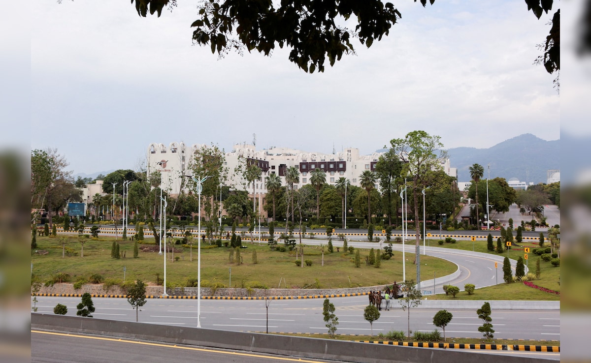 A police officer stands guard on a road leading to Serena Hotel as delegations from the United States and Iran are expected to hold peace talks in Islamabad, Pakistan (Image/Reuters) A police officer stands guard on a road leading to Serena Hotel as delegations from the United States and Iran are expected to hold peace talks in Islamabad, Pakistan (Image/Reuters)