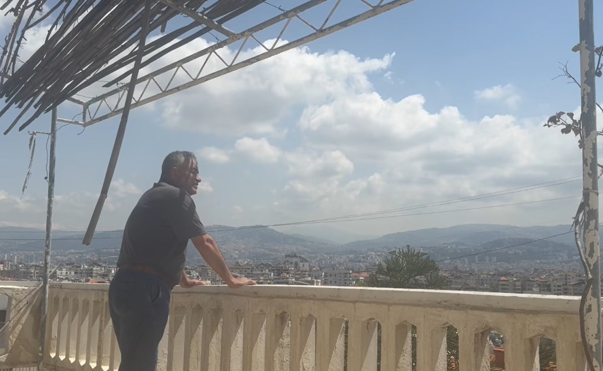 Sheikh Moussa on the roof of his family home