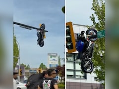 गजब! BMW से ऐसी भिड़ंत कि दूर हवा में खंभे पर जा लटकी मोटरसाइकिल, हादसे का VIDEO देख लोग हैरान