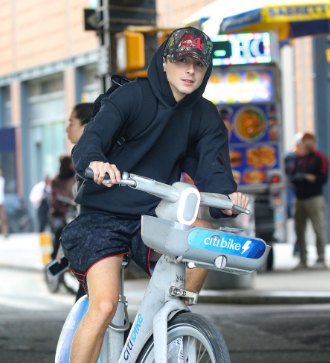 Timothee Chalamet Soaks Up The Sunny Weather As He Bikes Around New York City