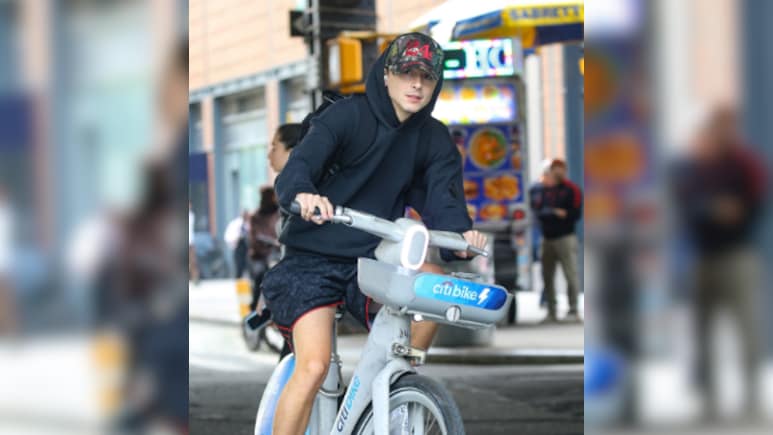 Timothee Chalamet Soaks Up The Sunny Weather As He Bikes Around New York City