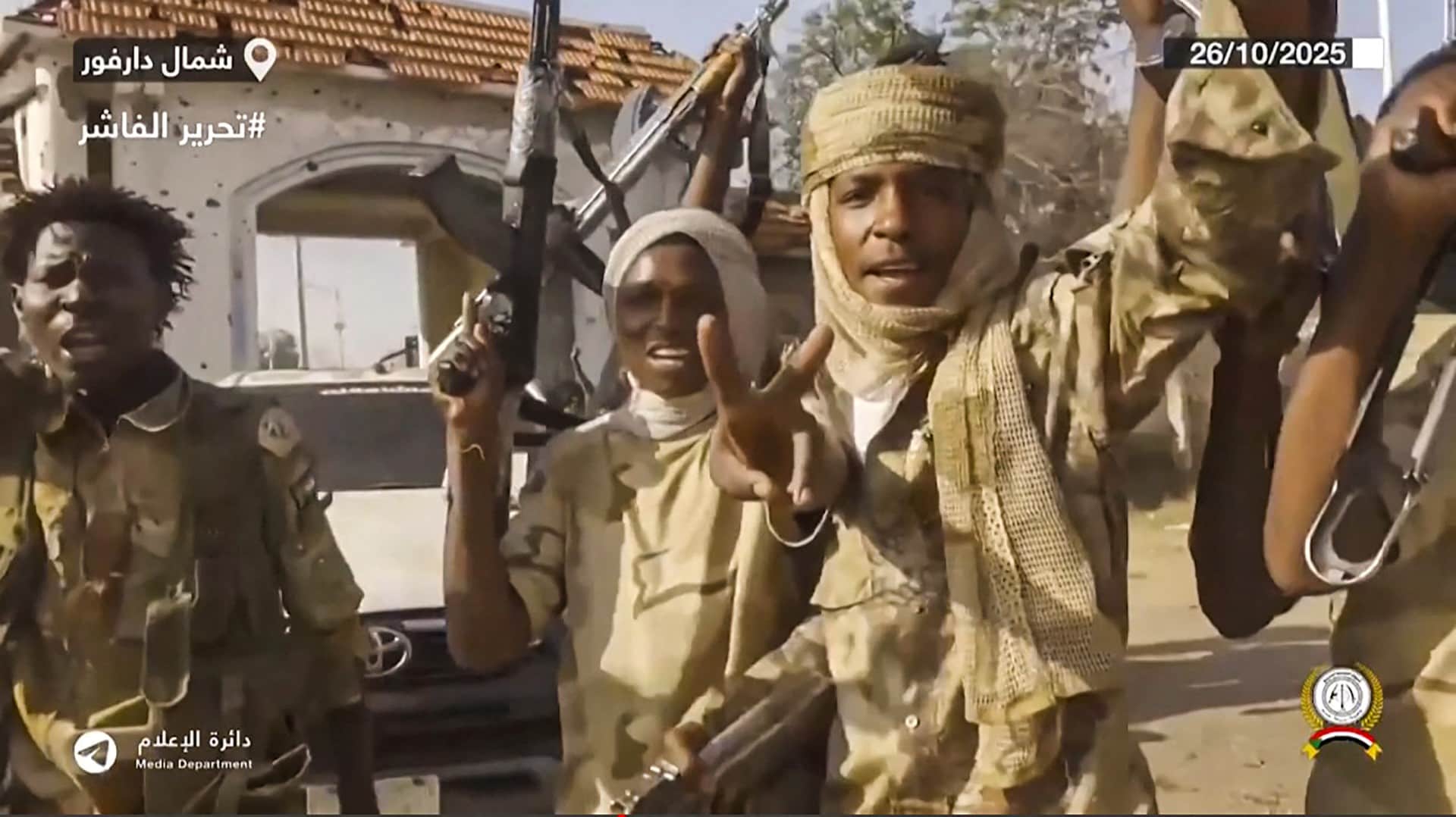 This image grab taken from handout video footage released on Sudans paramilitary Rapid Support Forces (RSF) Telegram account on October 26, 2025, shows RSF fighters holding weapons and celebrating in the streets of El-Fasher in Sudans Darfur.