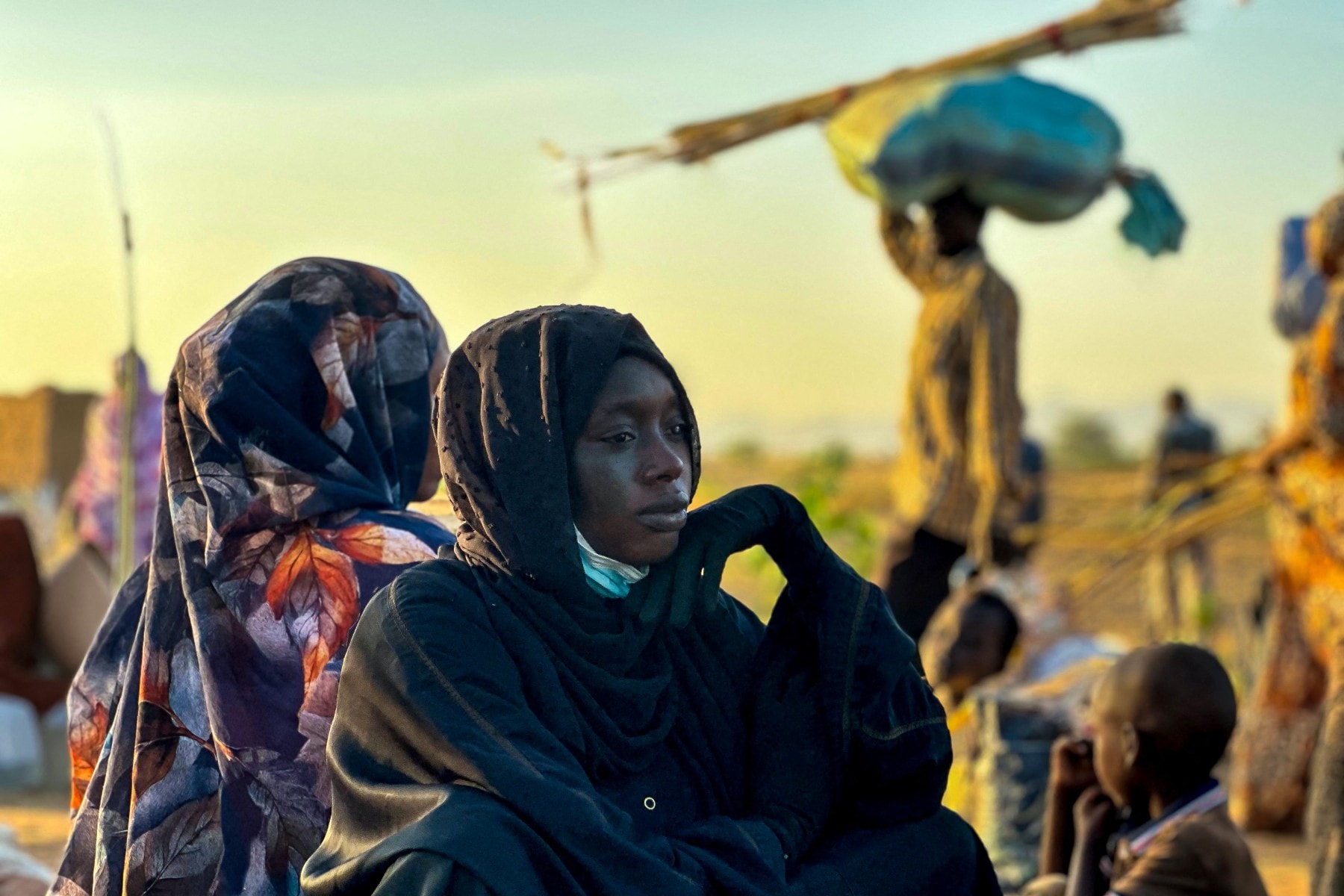 A displaced woman rests in Tawila, in the countrys war-torn western Darfur region, on October 28, 2025, after fleeing El-Fasher following the city's fall to the Rapid Support Forces (RSF).