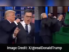 Watch: Trump Tosses Colbert In Dumpster Before Dancing In AI-Generated Clip