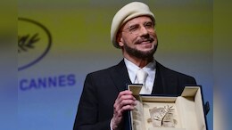 John Travolta On His Viral Beret Look At Cannes: &ldquo;I&rsquo;m Gonna Do An Homage To Being A Director&rdquo;