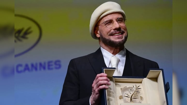 John Travolta On His Viral Beret Look At Cannes: &ldquo;I&rsquo;m Gonna Do An Homage To Being A Director&rdquo;