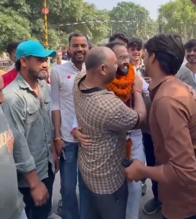 People were seen hugging rape-accused Sushil Prajapati, while some even touched his feet
