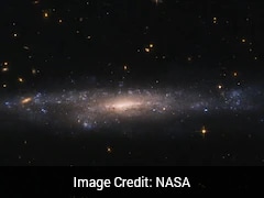 NASA's Hubble Telescope Spots Mysterious Dim Galaxy Hidden In Space