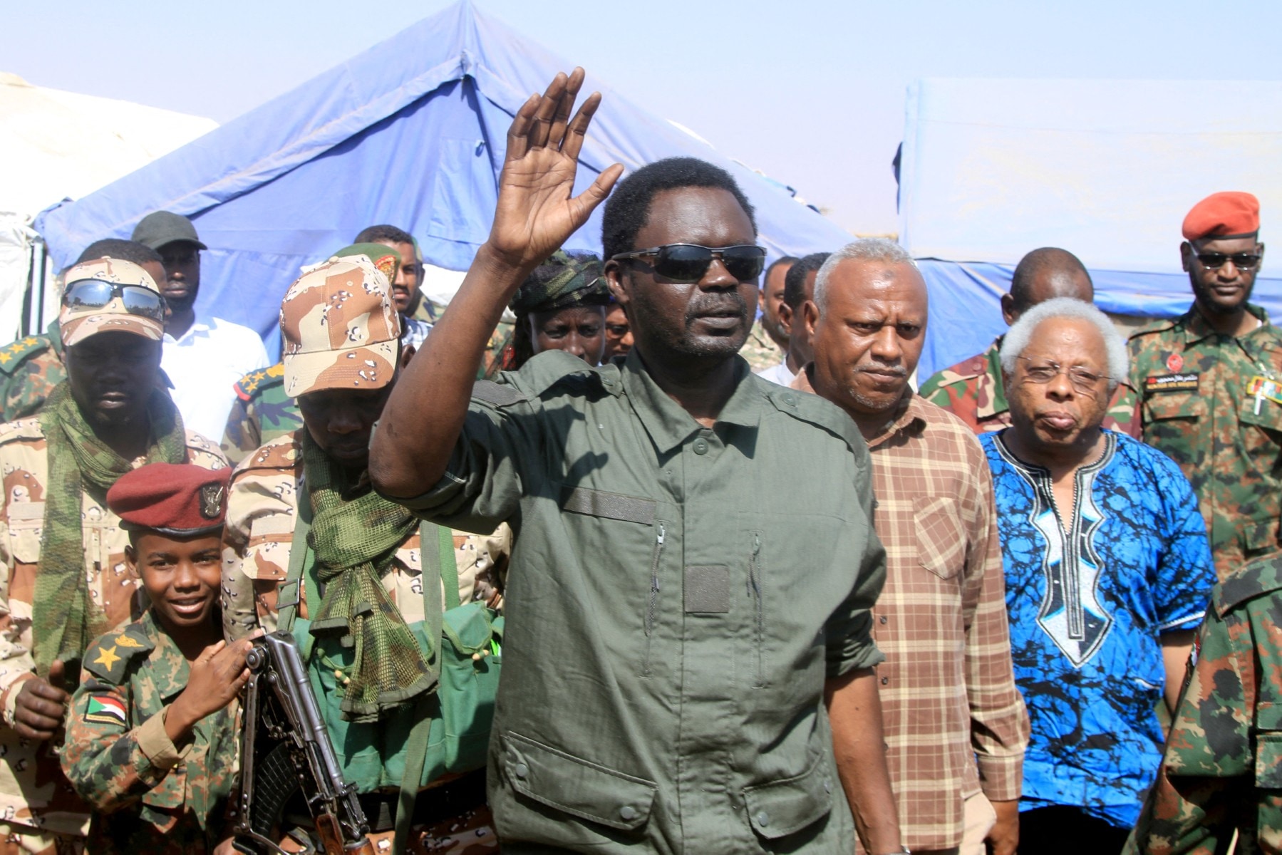 Darfur Regional Governor and leader of the Sudan Liberation Movement (SLM), Minni Arko Minnawi, gestures as he arrives at the Al-Afad camp for displaced people in the town of Al-Dabba, northern Sudan, on November 26, 2025.