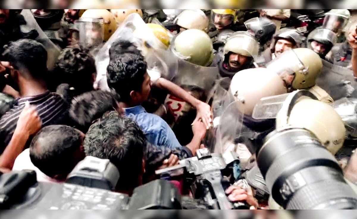 SFI workers protesting in Kerala over NEET cancellation.