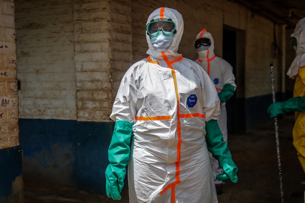 Health workers wearing protective equipment gather to disinfect the isolation area for Ebola patients at the General Referral Hospital of Mongbwalu in Mongbwalu, on May 23, 2026. Health workers wearing protective equipment gather to disinfect the isolation area for Ebola patients at the General Referral Hospital of Mongbwalu in Mongbwalu, on May 23, 2026.