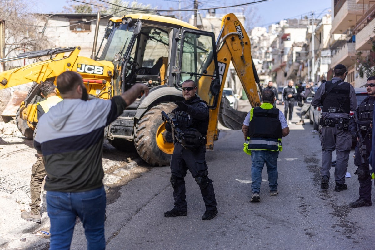 A resident argues with a member of the Israeli police forces during the demolition of a structure in the al-Bustan area of the Palestinian neighbourhood of Silwan, in Israeli-annexed east Jerusalem, on February 10, 2026. A resident argues with a member of the Israeli police forces during the demolition of a structure in the al-Bustan area of the Palestinian neighbourhood of Silwan, in Israeli-annexed east Jerusalem, on February 10, 2026.