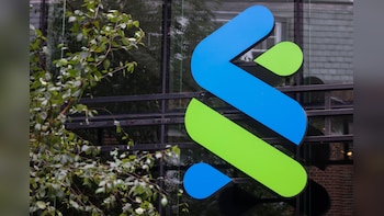 Standard Chartered to Slash Back-Office Roles to Boost Returns