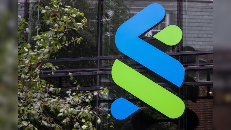 Standard Chartered to Slash Back-Office Roles to Boost Returns