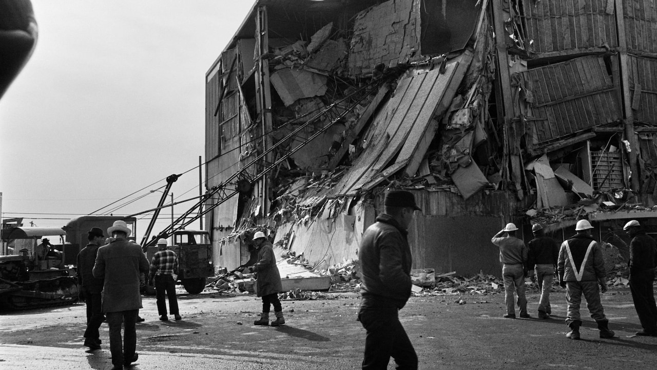 Firefighters intervene on a damaged building on March 30, 1964 in Anchorage, Alaska, after the March 27, 1964 earthquake, that left 131 victims and caused a tsunami that killed 14 people in California and caused damage across the entire American west coast. The 1964 earthquake in Alaska is one of the most powerful earthquakes ever recorded in the world with a magnitude 9.2 (between 9.1 and 9.3) on the Richter scale, and the second largest earthquake after an M9.5 earthquake in Chile in 1960. (Photo by AFP)